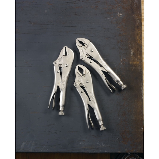Three IRWIN locking pliers are arranged on a metal surface. The pliers are silver in color and feature adjustable jaws and locking mechanisms.