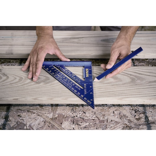 IRWIN 1794463 blue metal speed square used for marking wood, photography of product in use.