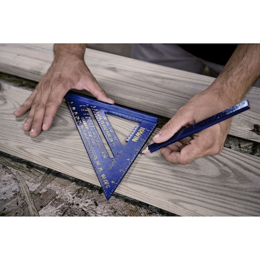 IRWIN 1794463 blue carpenter square used to mark wood board, close-up photography.