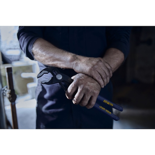 IRWIN¨ TRADE STRONGª Plumber Portrait in Environment Hand Close Up Holding Pliers (2078112)