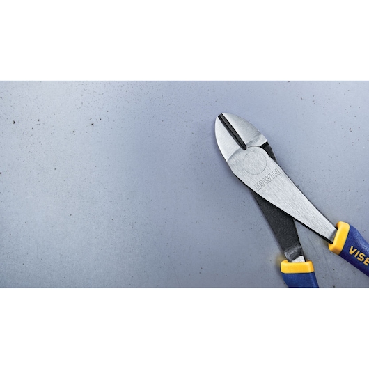 Photo of IRWIN diagonal cutting pliers 2078306 with blue and yellow handles on a gray surface.