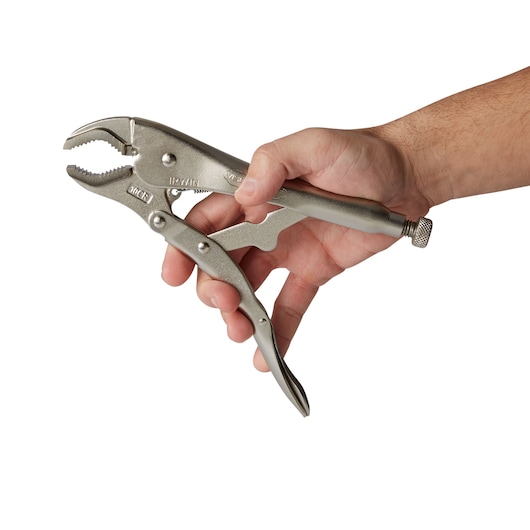 Photo of IRWIN 4935580 locking pliers held in a right hand, angled on white background.