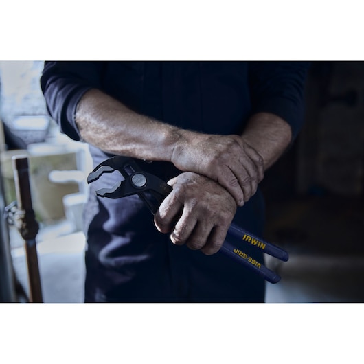IRWIN¨ TRADE STRONGª Plumber Portrait in Environment Hand Close Up Holding Pliers (2078112)