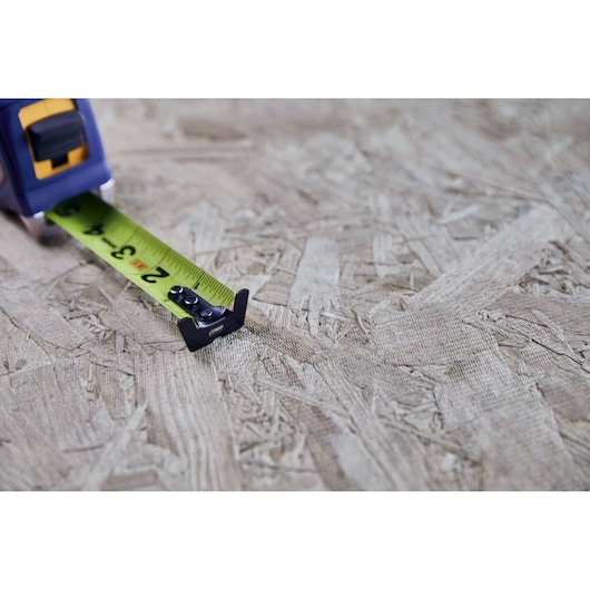 IRWIN (R) TRADE STRONG (TM) Strait-Line (R) Tape in Environment Showing XL Hook Feature in Application on Wood Material