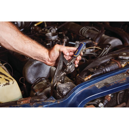 IRWIN IRHT82573 locking pliers used on a car engine component, blue and yellow handle visible.