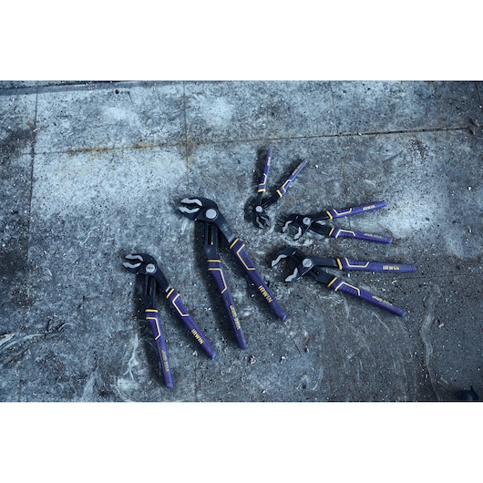 IRWIN 2078112 groove joint pliers set with blue and yellow handles on concrete surface, top view.