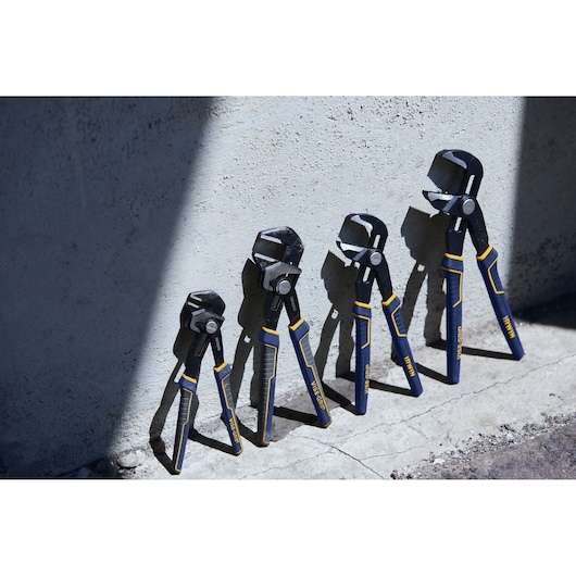 IRWIN IRHT82636 photography of four blue and yellow groove joint pliers lined up on concrete surface.
