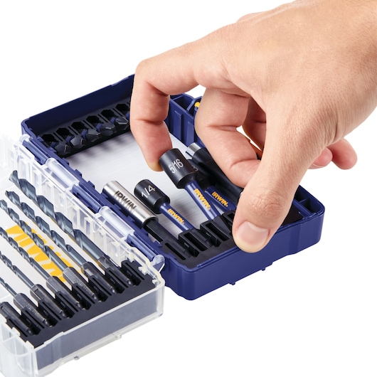 Photo of IRWIN drill and driver bit set IWAF1319 in blue case with a hand selecting a bit, close-up angle.