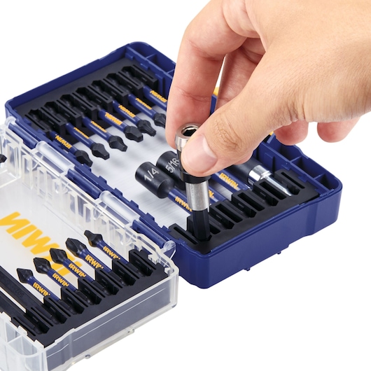 Photo of IRWIN IWAF1326 drill and driver bit set with hand picking a bit, blue case, white background.