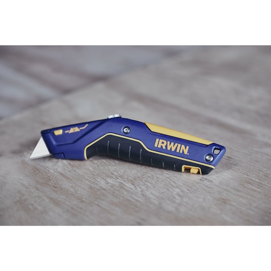 IRWIN® TRADE STRONG™ Strait-Line® Utility Knife on Wooden Surface in Environment 