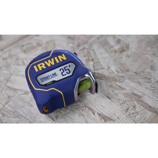 IRWIN (R) TRADE STRONG (TM) Strait-Line (R) Tape Measure Laying on Wood Material in Environment