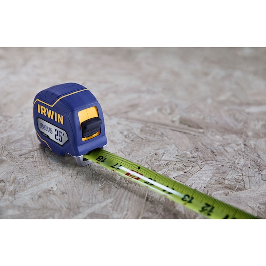 IRWIN (R) TRADE STRONG (TM) Strait-Line (R) Tape Measure Showing Tear Protection in Application on Wood Material