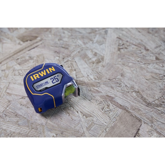 IRWIN (R) TRADE STRONG (TM) Strait-Line (R) Tape Measure Laying on Wood Material in Environment